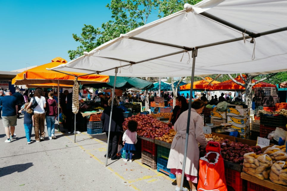 Farmers market with vegetables and vendors